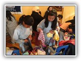 Children selecting clothing - Muyurco, May 30, 2018