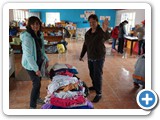 Aracely and Lucia managing clothing in Chaupiloma (28 Nov 2019)