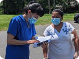 Cecy discusses health issues during a food distribution - Jun 2020