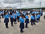 Students praying at Nino Emanuel school at Chaupiloma - June 5, 2023