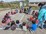 Jakelin leads a game with children at Patricia Brown school at Santa Monica - June 4, 2023